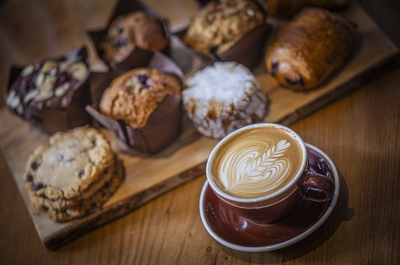 Coffee and muffins on a table.